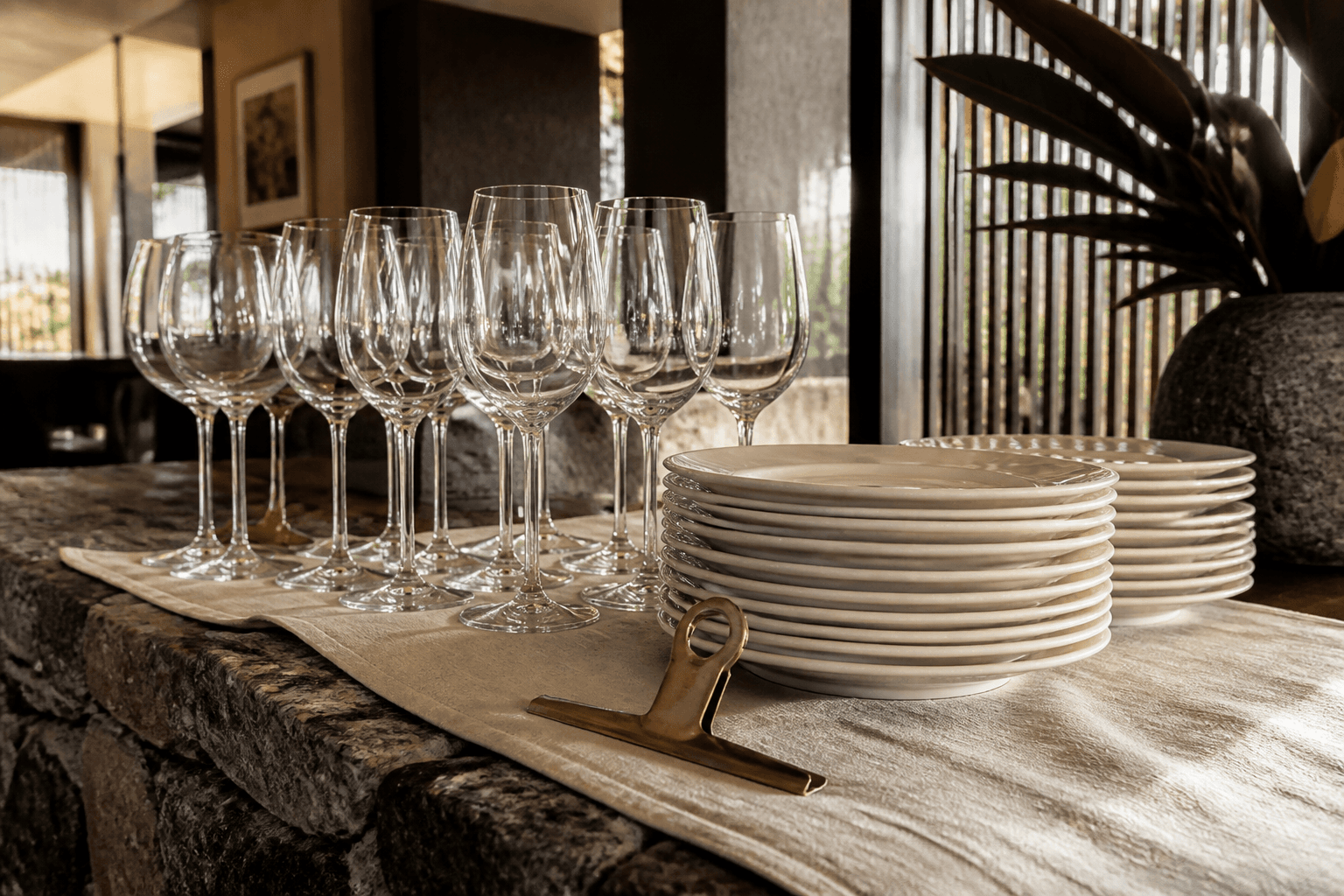 Unused empty stemware lined on a sand linen pass, brass clip.